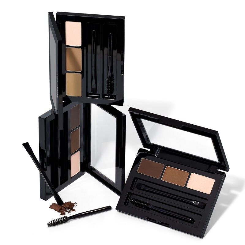 Stacked limited-edition Mary Kay Brow Kits in shades Blonde, Brunette and Dark Brunette against plain background image number null