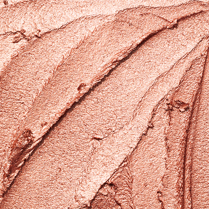 Up close shot of a gold Mary Kay Shimmer Eye Shadow Stick texture rub